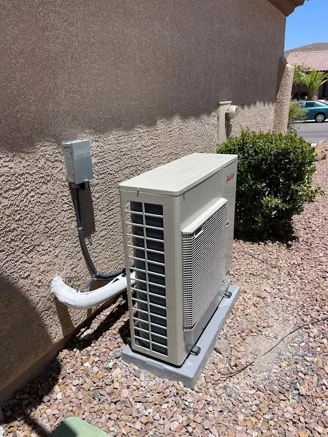 Residential air conditioning condenser unit in Corrales